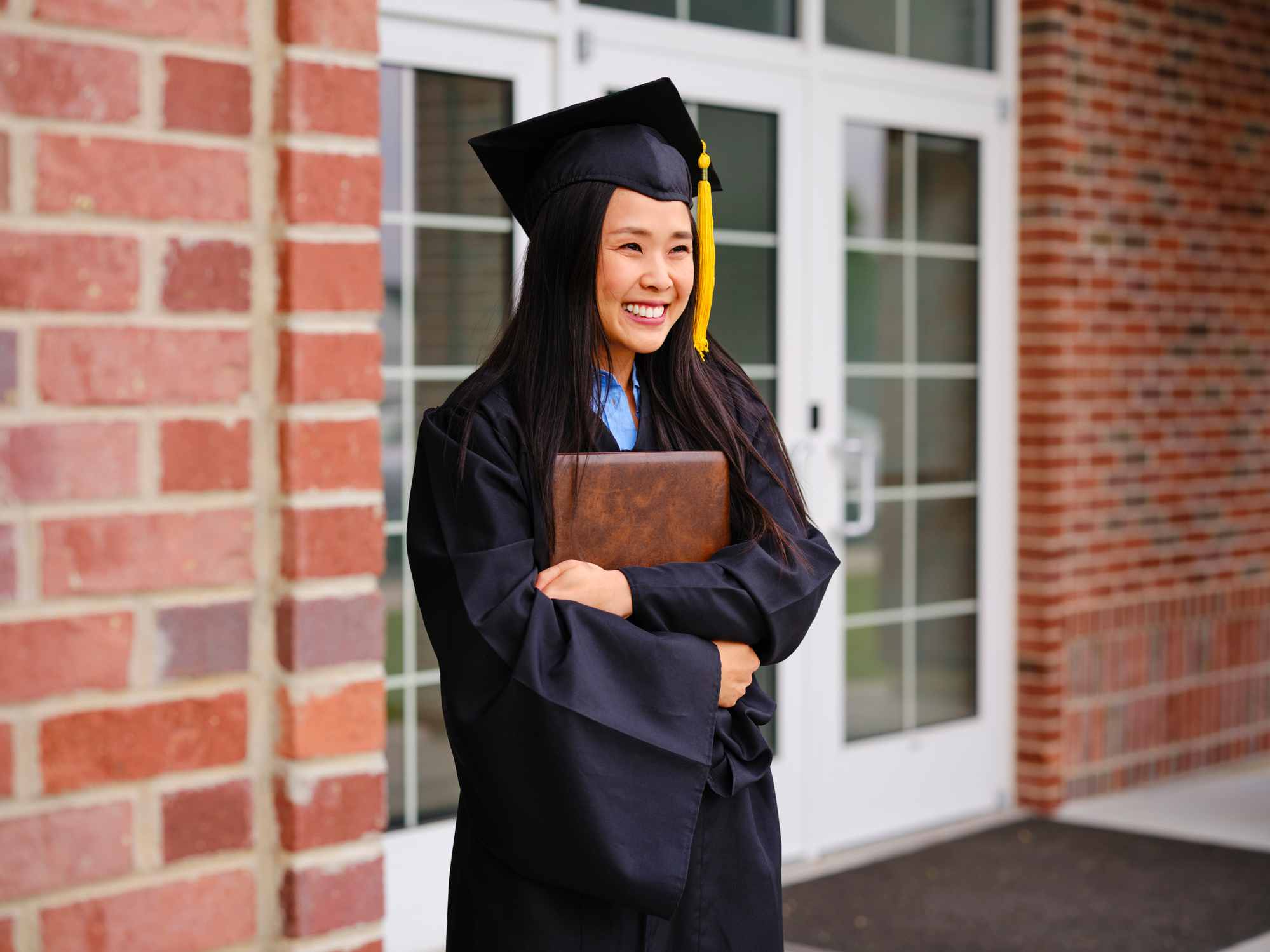 Graduate holding a diploma