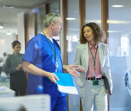 Healthcare professionals meeting and talking in an office