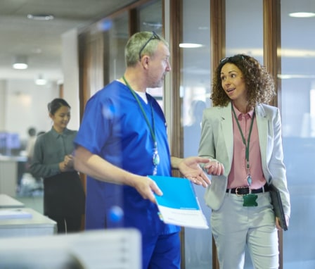 Healthcare professionals meeting and talking in an office