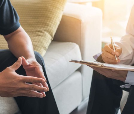 Counselor consulting with patient