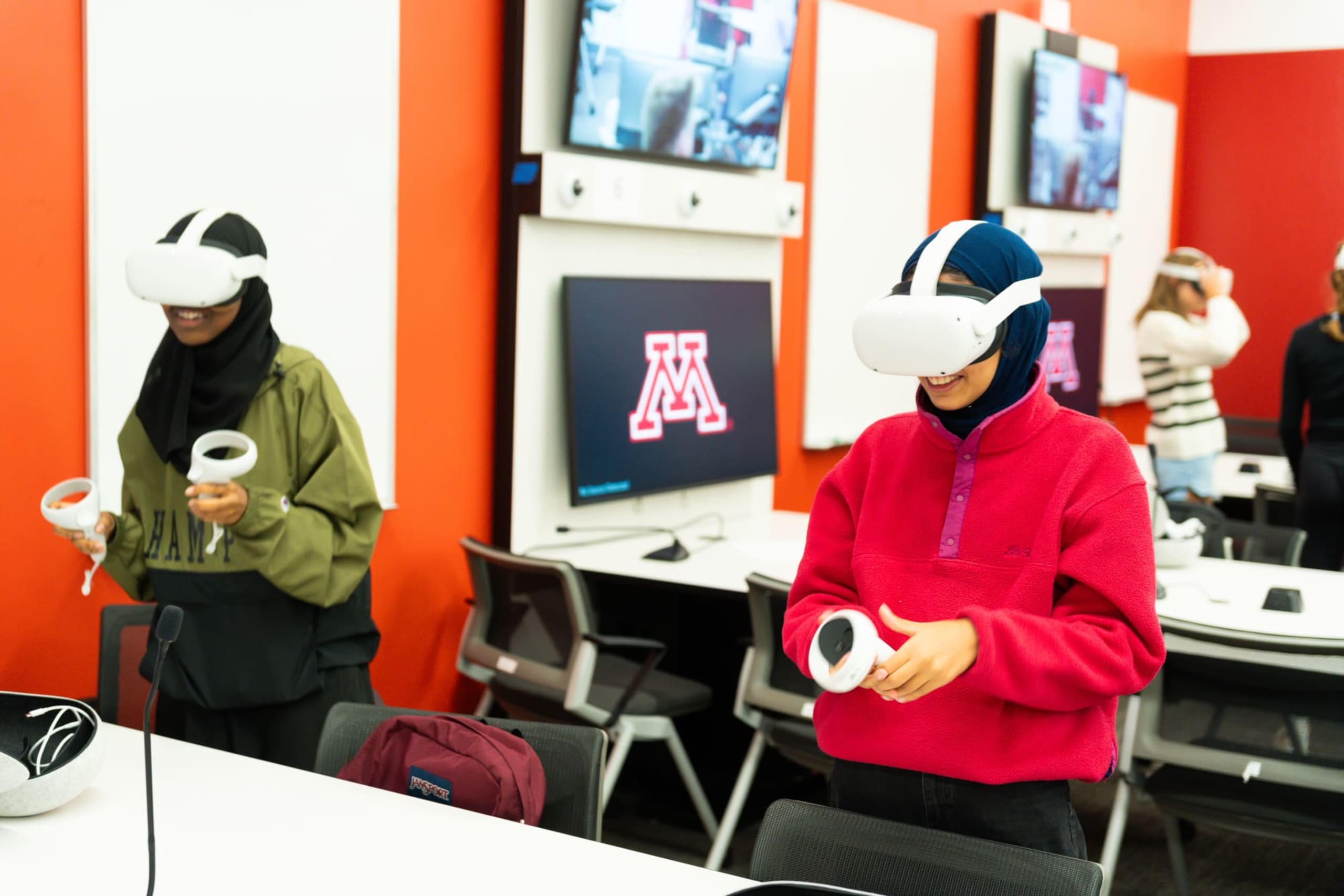 Two students using VR headsets