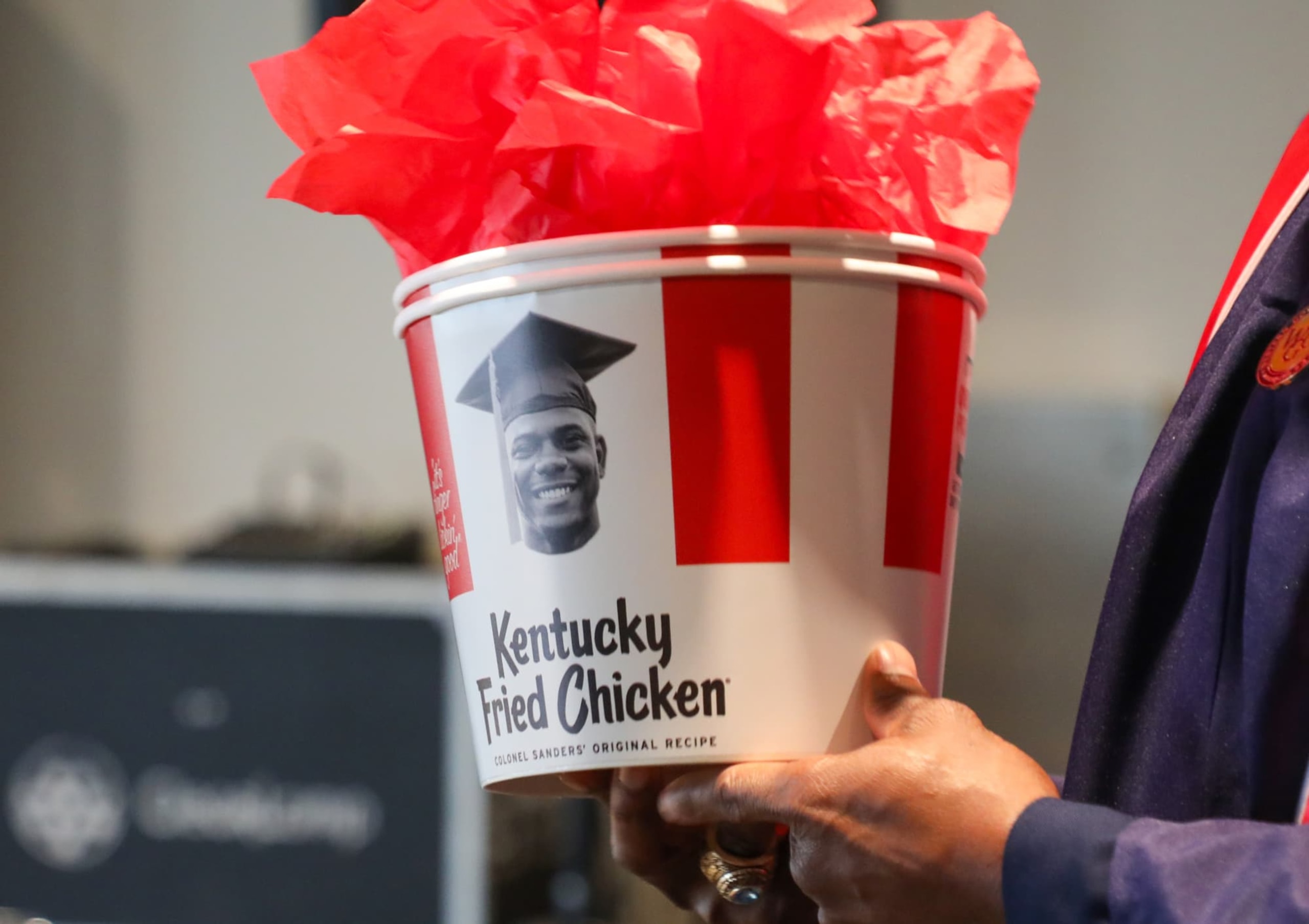 A specially-made, personalized KFC bucket with Kevon's face in place of the colonel's.