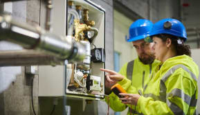 electrician trains student on the job
