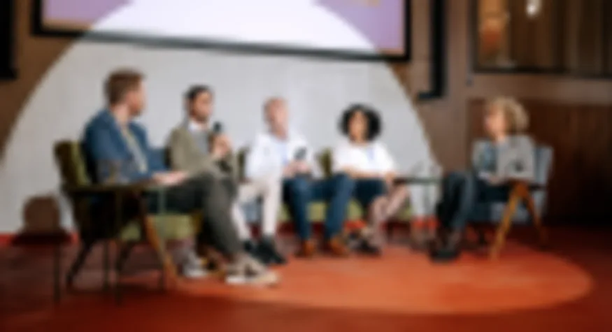 Group of panelists address crowd