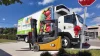 A new refrigerated box truck and forklift sit outside United Food Bank and Services.