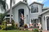 Home with a Yard of the Month sign in yard