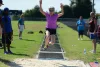 Person doing long jump during Active Life games.