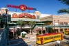 Centro Ybor entrance with yellow trams and visiting tourists, Tampa, FL