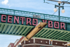 Tampa, USA downtown city in Florida in historic Latin American district of Centro Ybor old town with streetcar station by pedestrian overpass bridge
