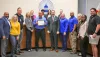 Commissioners and BOCC staff present award tp Dave Dovobo (center)