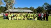 Students from Lutz K-8 School gather for a group photo at Lake Park.