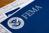 Forms on a table with the FEMA logo