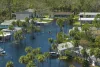 Surrounded by hurricane rainfall flood waters homes in a Florida residential area.