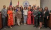 A group picture of the Hispanic Heritage Foundation receiving a proclamation from Commissioner Miller