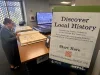 Woman standing at a library kiosk