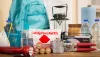 Hurricane Kit with backpack, bottled water, face mask, lantern, peanut butter, paper towels, hand sanitizer, first aid kit, portable radio, flashlight, batteries, cans of tuna, and can opener.