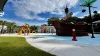 Splash pad with a pirate ship and other playground equipment.