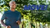 Move Hillsborough - A smiling man running through the woods