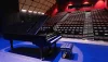 A grand piano sits on the stage at the New Tampa Performing Arts Center