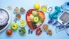 A heart shaped plate of healthy foods, surrounded by more health eating options like olive, nuts, seeds