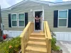 Kristina Stamm receives a new mobile home as part of the Rebuilding for Tomorrow hurricane recovery program
