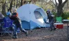 Upper Tampa Bay Conservation Park - two kids in front of a tent chasing after a soccer ball