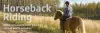 Woman riding a horse in a field - Horseback Riding - Saddle up to explore scenic trails and discover wildlife and nature