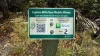 Sign with QR code to scan or info to download the guided audio tours