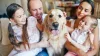 A family with their pet dog