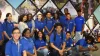 A group of students standing in the HR office