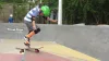 A kid doing a trick on a skateboard at the Apollo Beach skate park