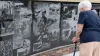 A person stands in front of a memorial at the Veterans Memorial Park and Museum