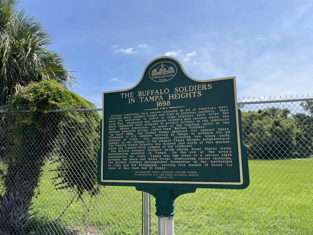 The Buffalo Soldiers in Tampa Heights historical marker is at the intersection of East Columbus Drive and North Central Avenue, on the left when traveling east on East Columbus Drive.