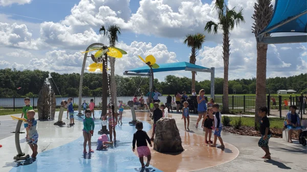 Carrollwood Village Park with kids playing in the splash pad area