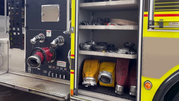 Various diameters and lengths of hoses are stored throughout the fire engine.