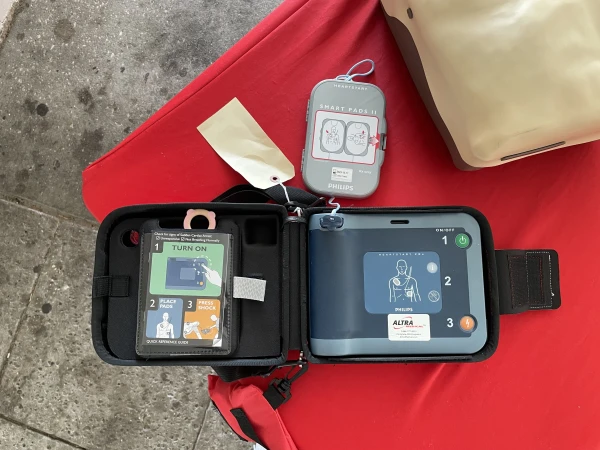 Contents of AED box, including defribulators, smart pads and simple instructions for use.