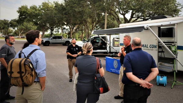 Animal Control officers give Hillsborough County Pet Resources staff and local residents an overview of the Command Post trailer.