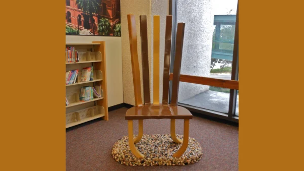 Sculpture - A wooden chair with 5 varied colored slats for the back