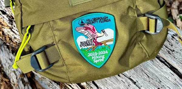The Roseate Spoonbill patch sewed on to a Mystery Ranch pack