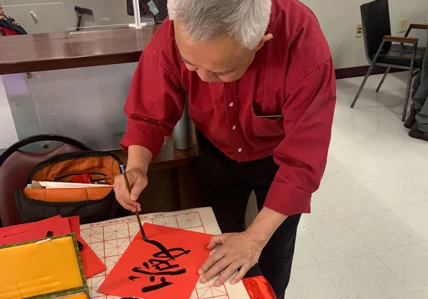 Calligraphy master at the Lunar New Year celebration at the Brandon Senior Center.