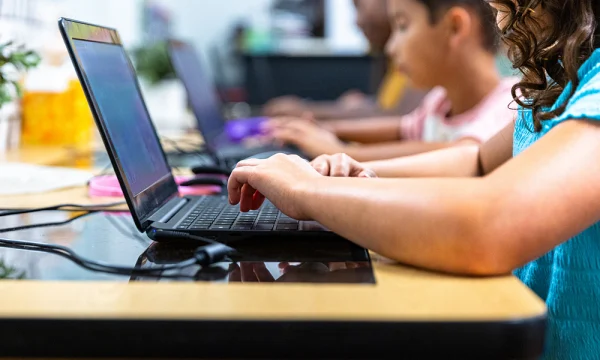 Kids on computers in classroom