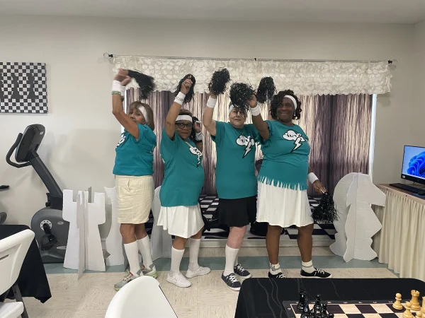 The Lutz Cheer Squad performs at the Lutz Senior Center before the chess tournament.