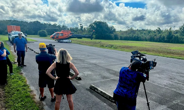 A Manatee County mosquito helicopter takes off ahead of a spraying operation