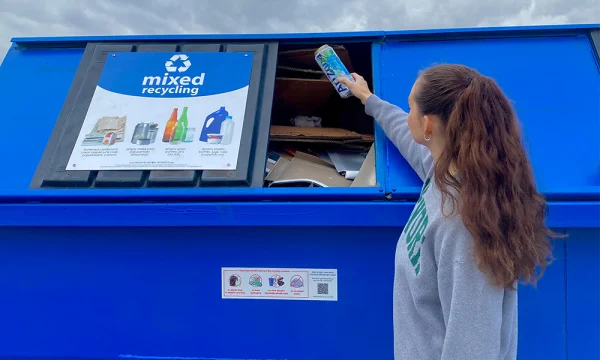 Resident using the free drop-off recycling program.