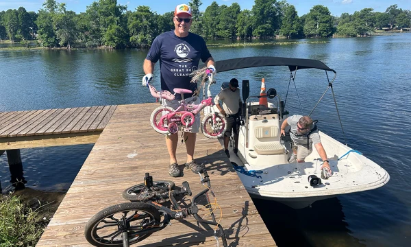 KTBB Deputy Director Allan Antolik unloads two bikes thrown into the Hillsborough River