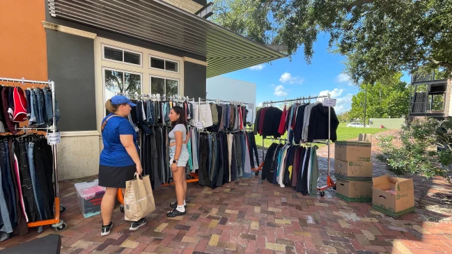 Paula, age 13, picks out a new outfit to wear to school.