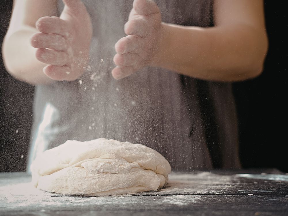 Person kneading bread