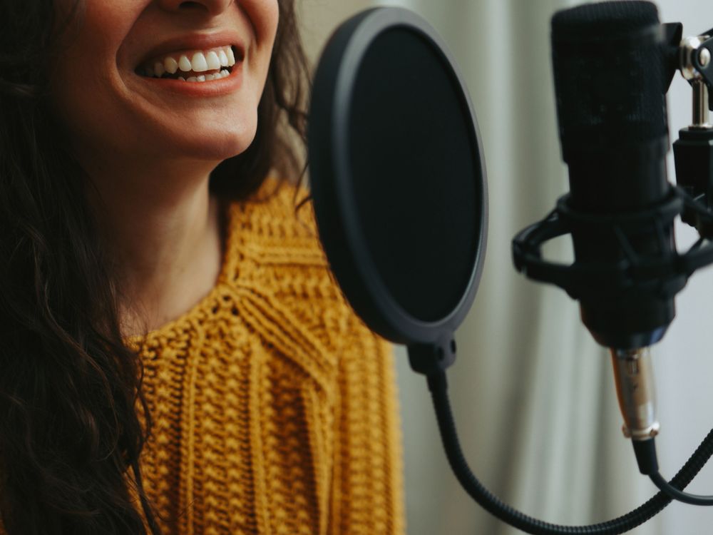 Woman at the dubbing microphone
