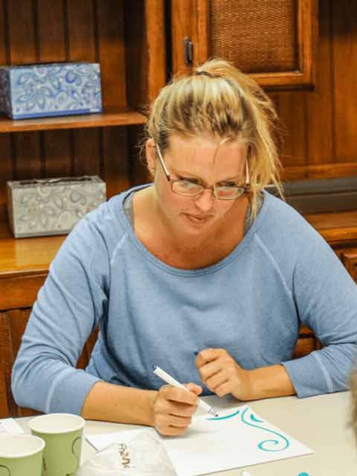 Art therapy is a type of therapeutic technique at Hawaii Island Recovery Client is painting a picture