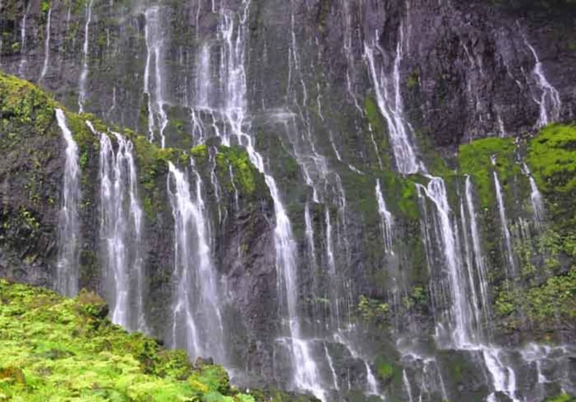The Waialeale Falls decorate the side of a shield volcano, Mount Wai’ale’ale. Waialeale falls in hawaii